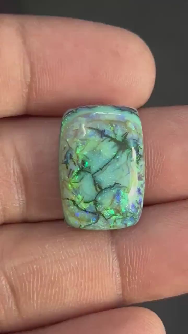 Video showing play-of-color and fire of Octagon Monarch Opal Cabochon from multiple angles