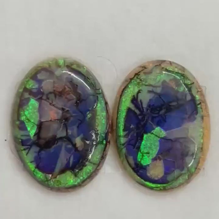 Video showcasing fire and color play in matched pair Sterling Opal Cabochons