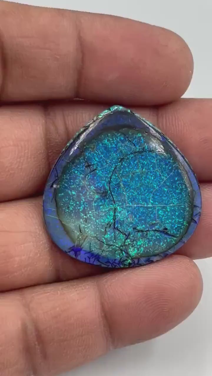 Video showcasing play-of-color and fire in Heart Shape Monarch Opal Cabochon