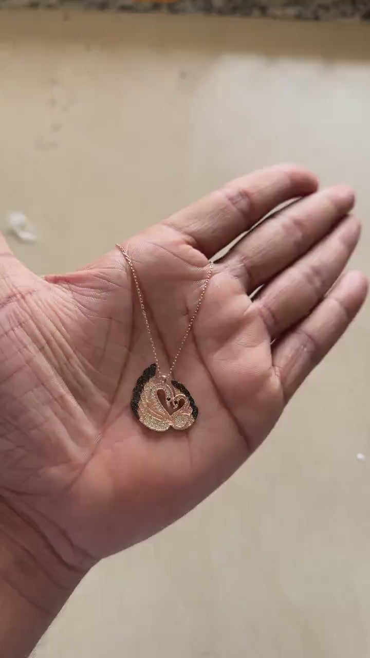 Rose gold swan pendant necklace shaped like a heart