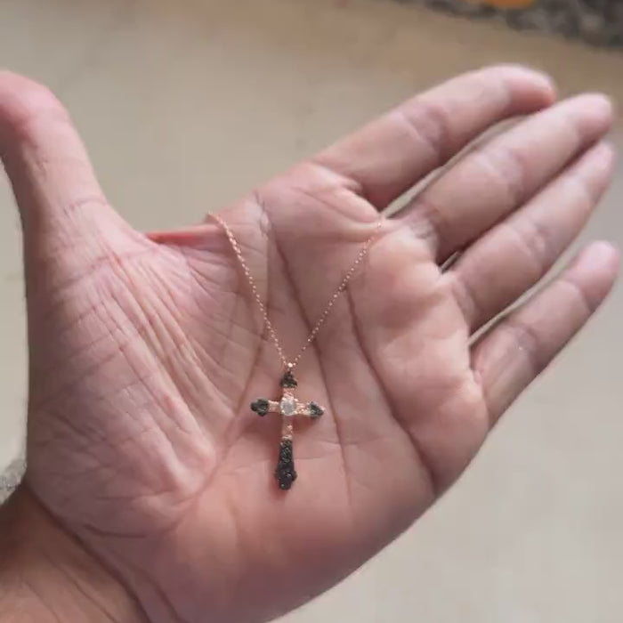 Rose gold cross pendant necklace with black and white pave stones