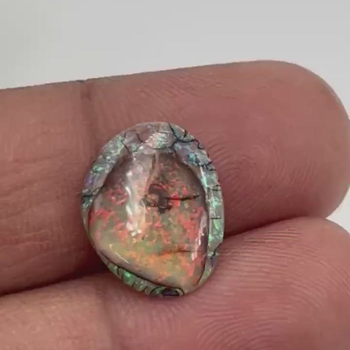 Video showcasing fire and color play in Petite Fancy Opal Cabochon