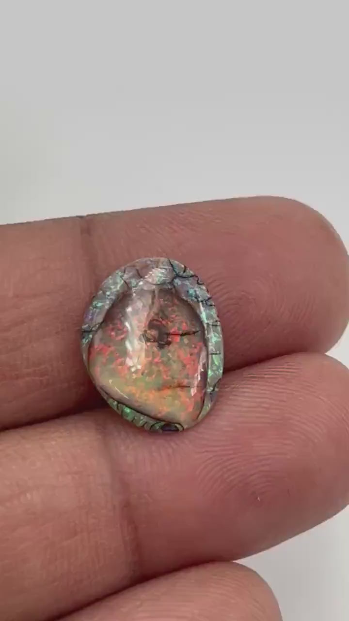 Video showcasing fire and color play in Petite Fancy Opal Cabochon