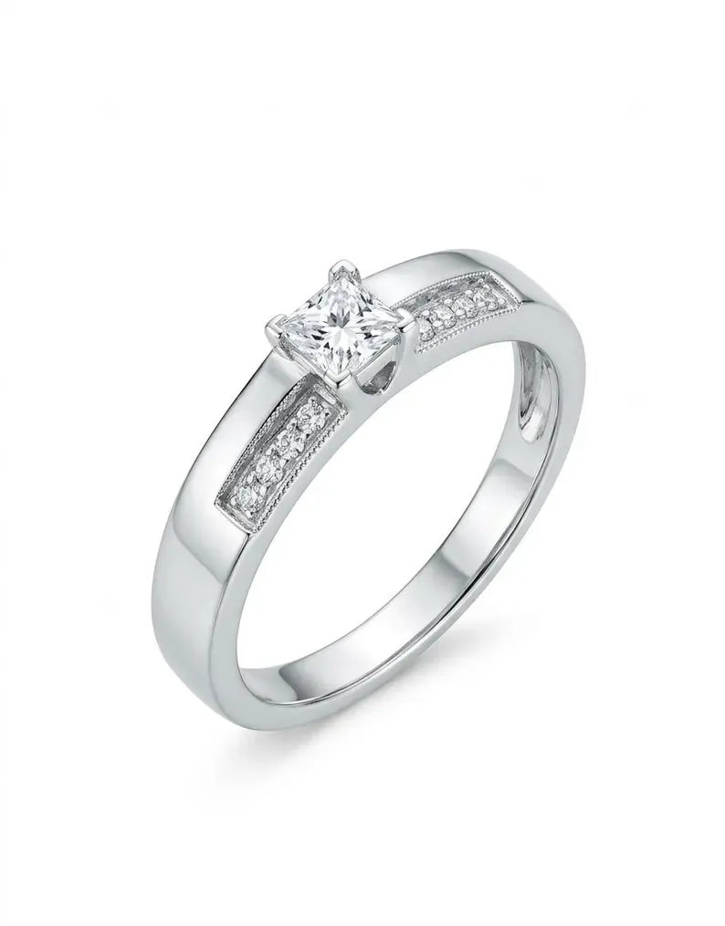 Close up of sterling silver princess cut solitaire ring with pave shoulder accents