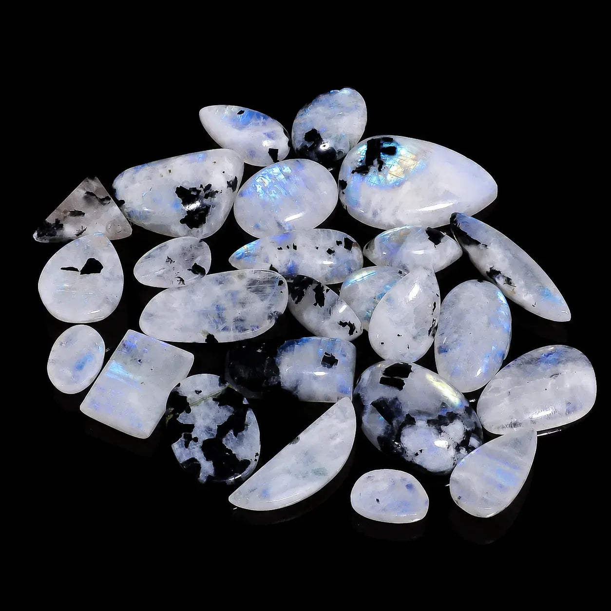Collection of rainbow moonstone stones on a black background