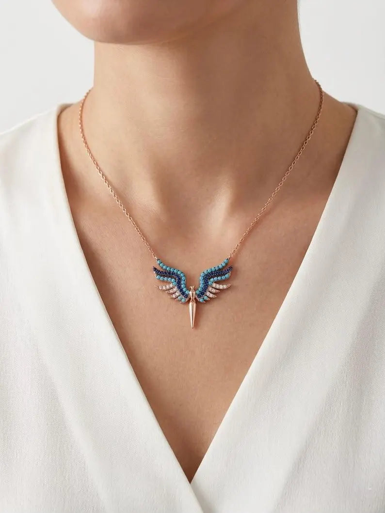 Rose gold angel wing necklace with white CZ pavé stones