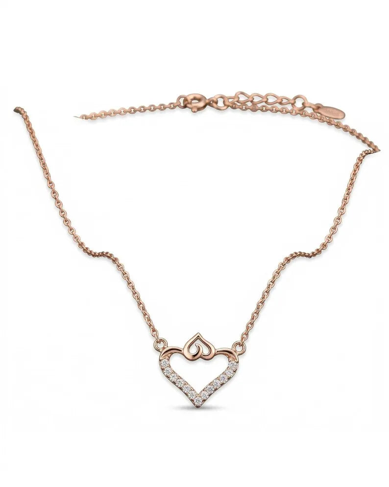 Double heart necklace worn at the collarbone