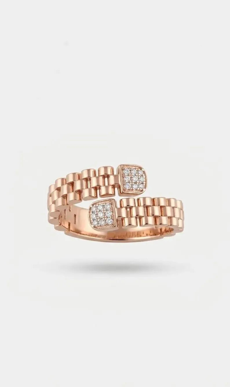 Top view of a rose gold plated sterling silver ring with a link band and two square CZ-set ends