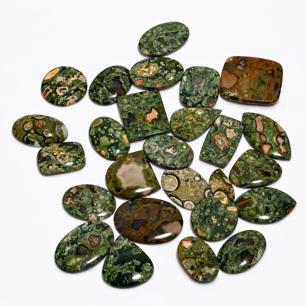 Collection of green and brown marbled stones on a white background