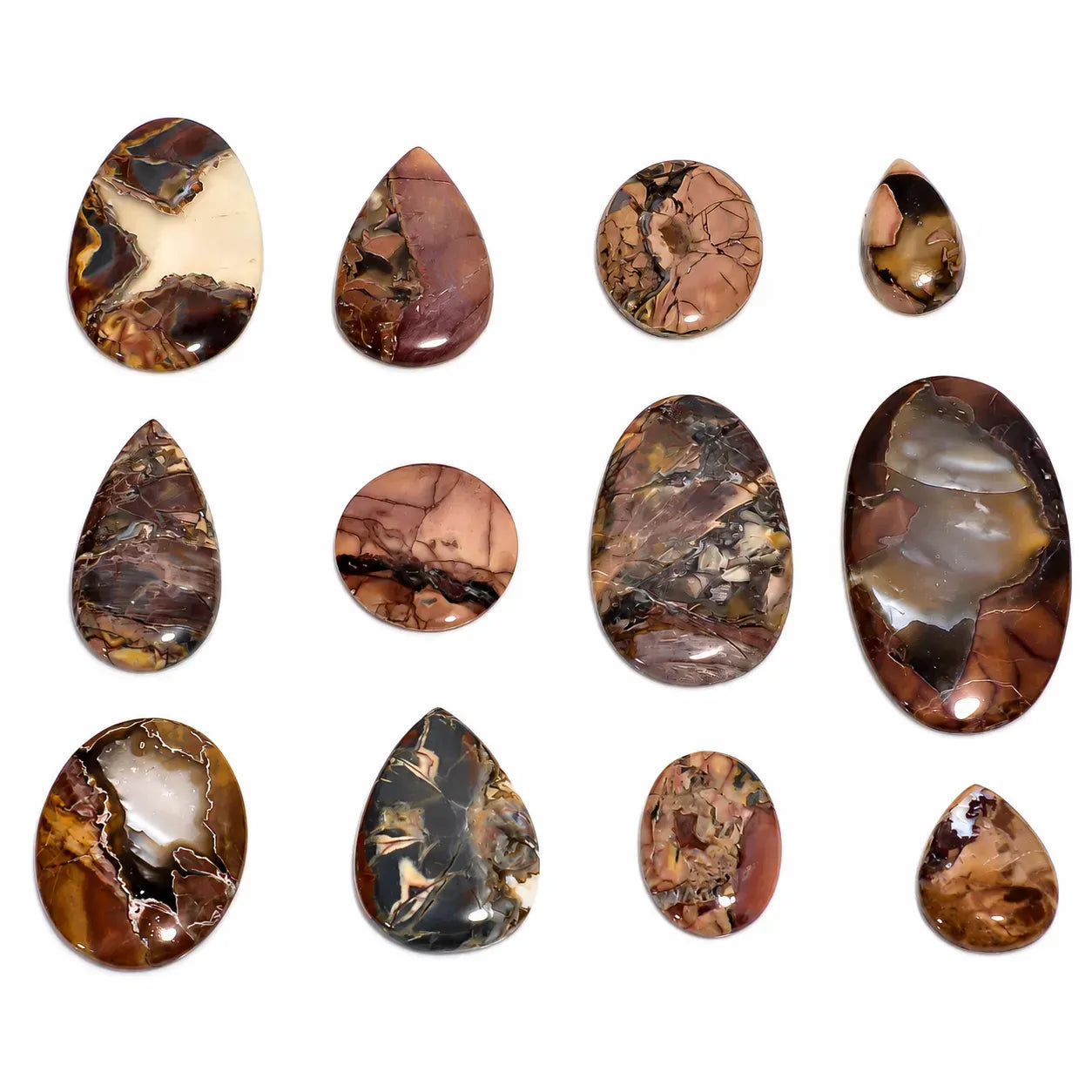Collection of marbled stone cabochons on a white background