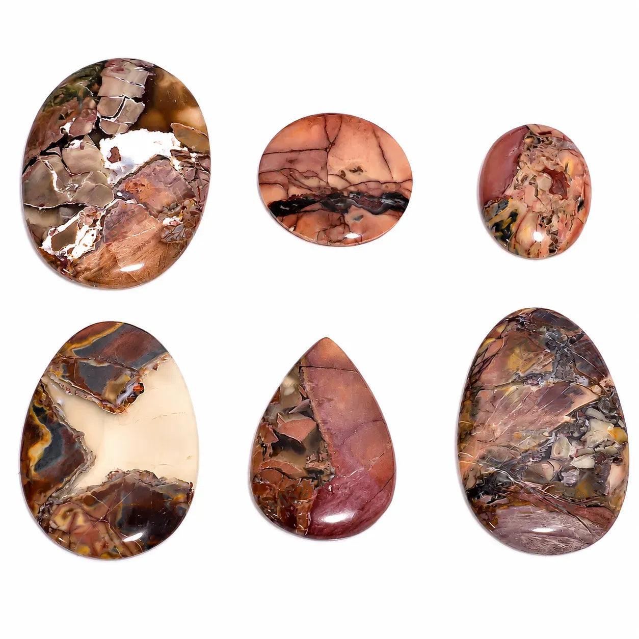 Set of marbled stone cabochons on a white background