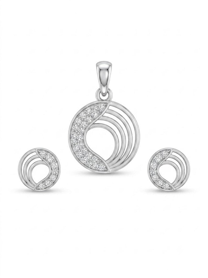 A silver-tone jewelry set featuring a crescent moon pendant and two matching crescent moon stud earrings, all embellished with clear pavé gemstones on a white background.