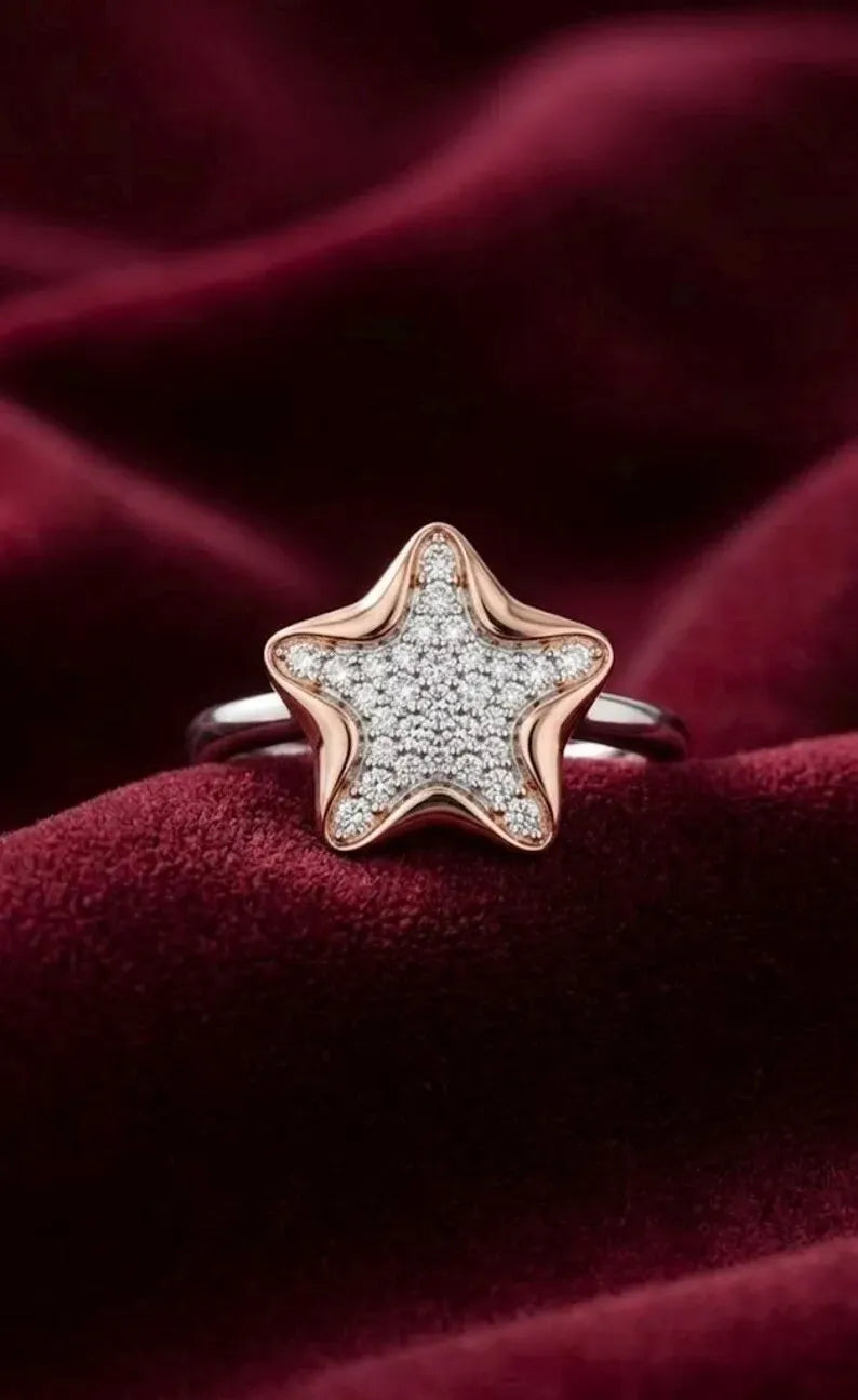 Close up of 925 sterling silver star ring with rose gold plated star charm and pave cubic zirconia detailing