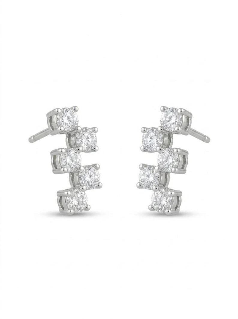 Sterling silver climber stud earrings laid flat, side view