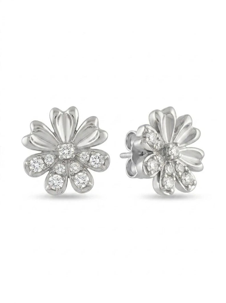 A pair of silver flower stud earrings with clear gemstones, shown from the front and side on a white background.