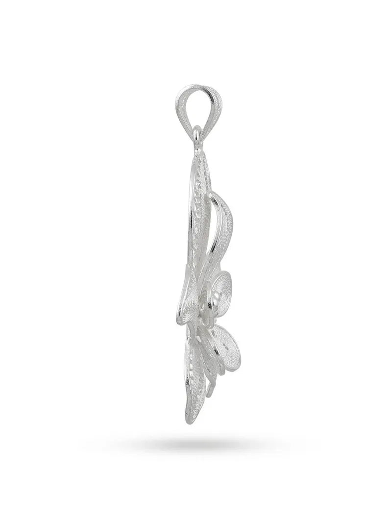 A silver filigree pendant with an organic, flowing leaf-like design and a top loop, shown against a plain white background with a soft shadow underneath.