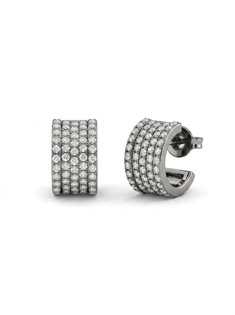 flexible Sterling silver pave huggie hoop earrings on a white background