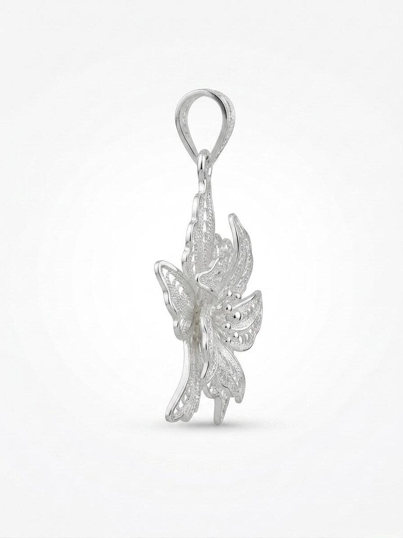 A silver fairy pendant charm with intricate wings and a top loop, shown on a clean white background.