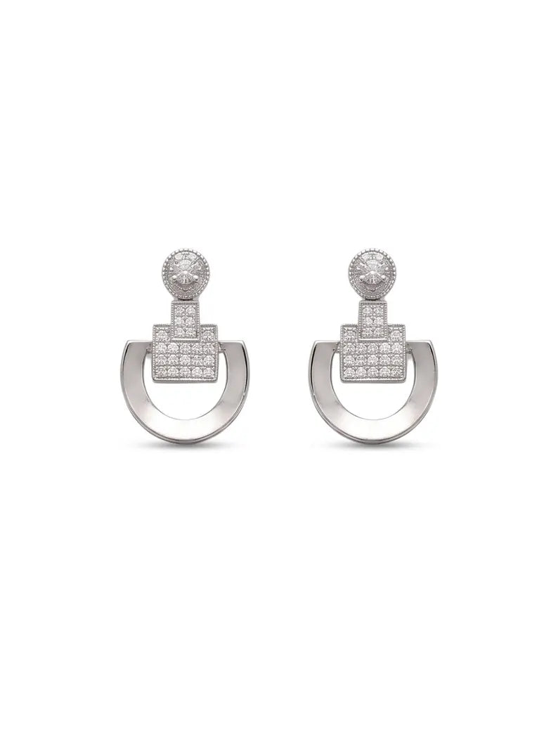 A pair of silver-toned geometric drop earrings with pavé-set clear stones, featuring a circular open hoop and a square-shaped pavé section on a white background.