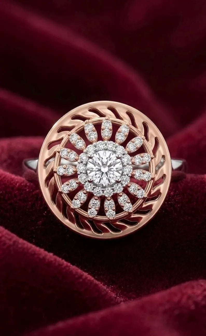 Close up of vintage inspired sunburst cocktail ring in sterling silver and rose gold with pave CZ accents