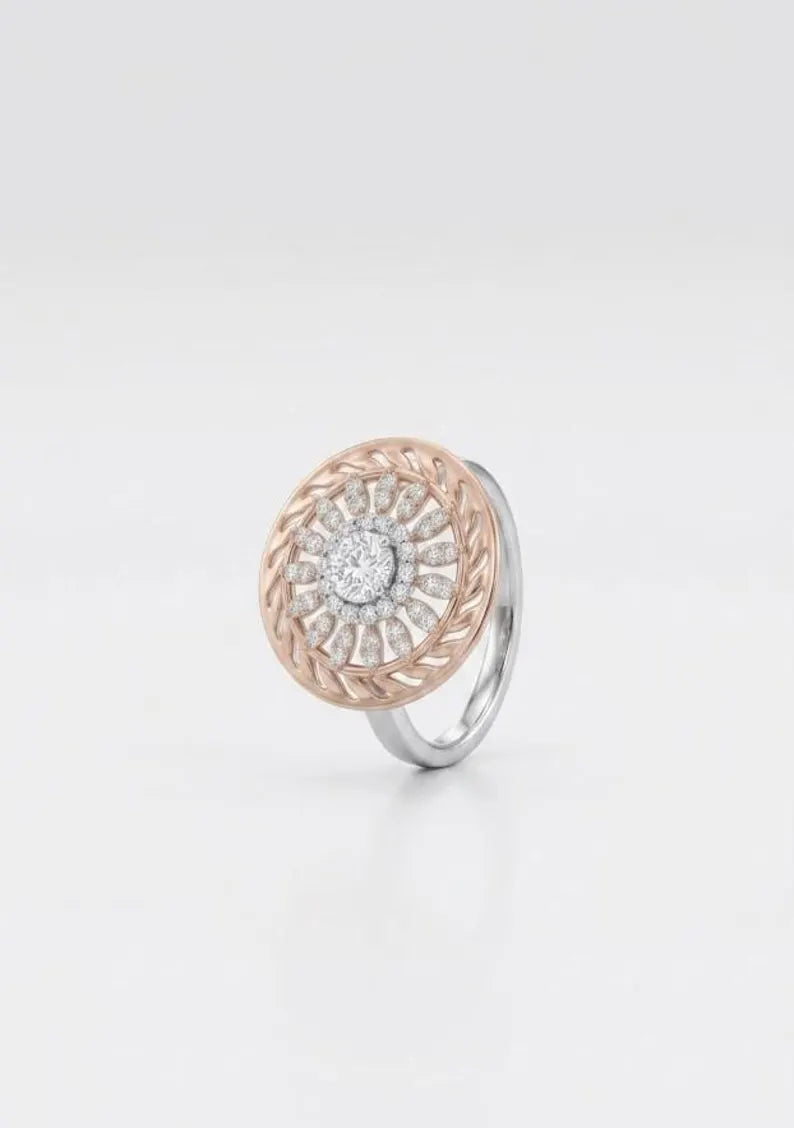 Side angle view of sterling silver sunburst statement ring with rose gold openwork and CZ center stone