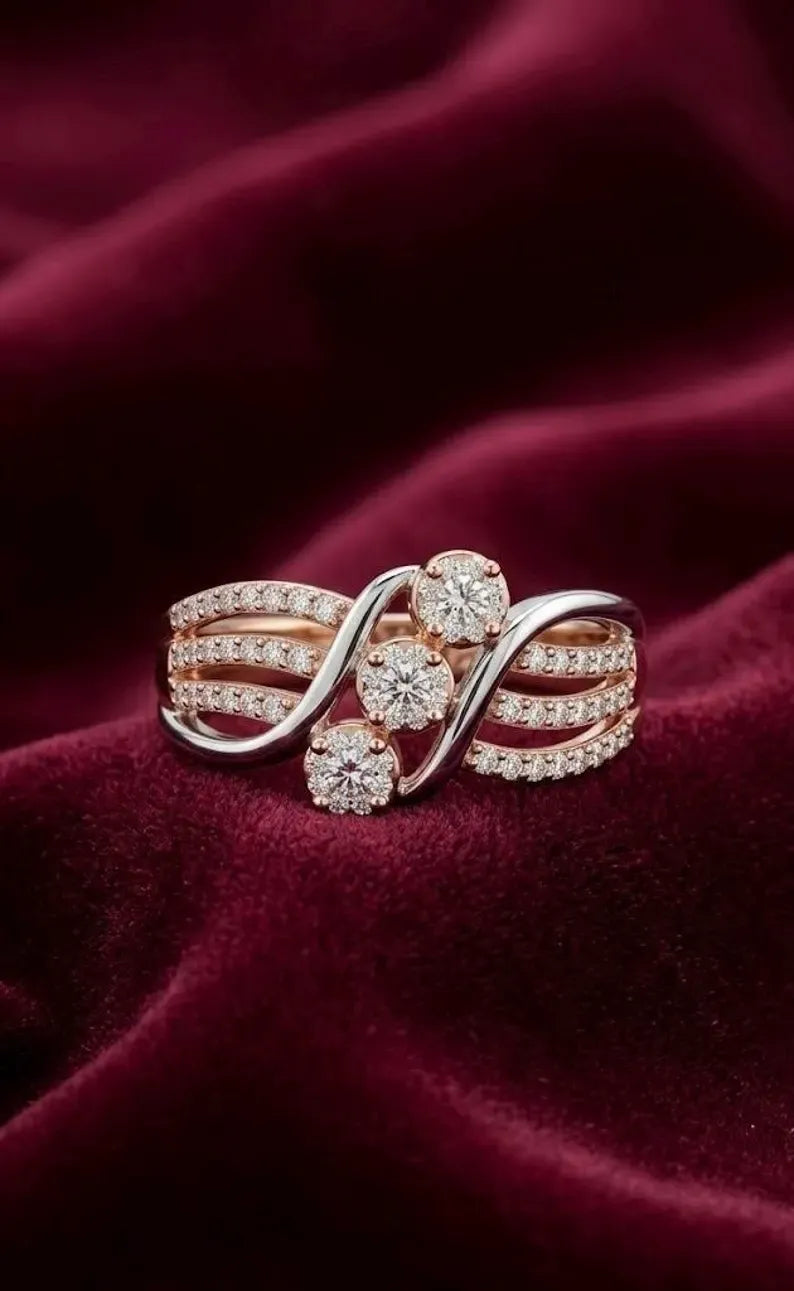 Front view of 925 sterling silver two tone wave ring with round cubic zirconia clusters