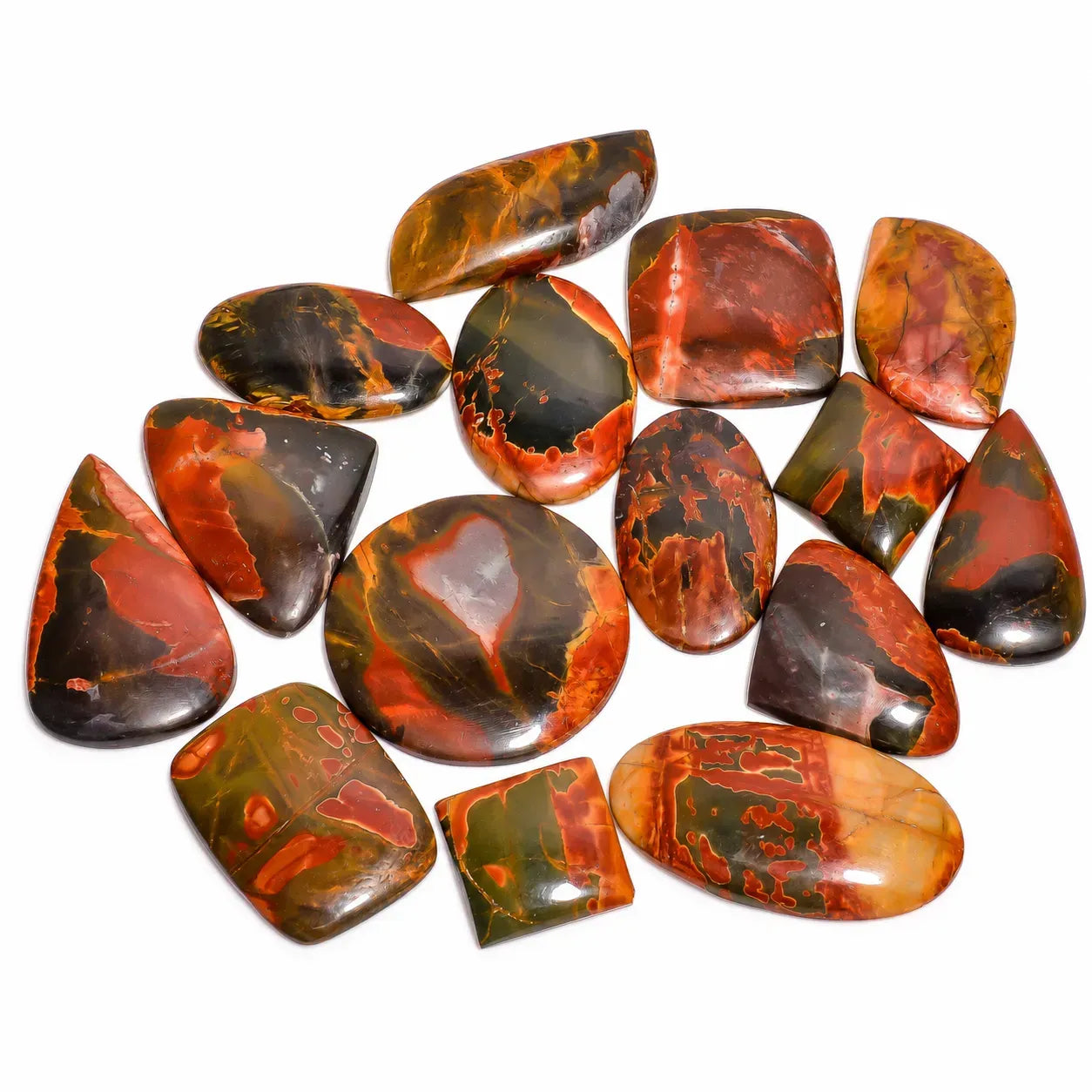 Collection of red and brown marbled stones on a white background