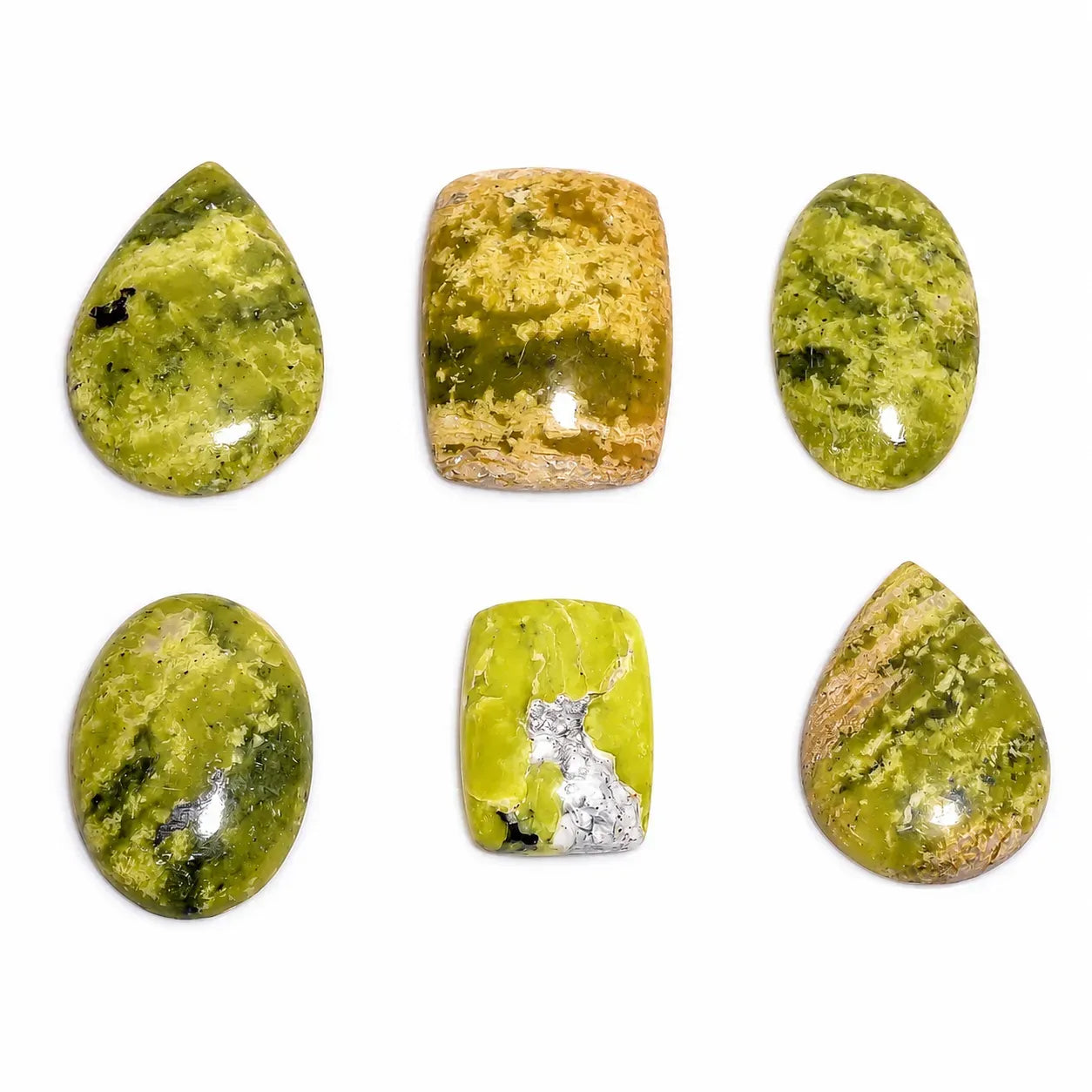 Set of green and brown stone beads on a white background